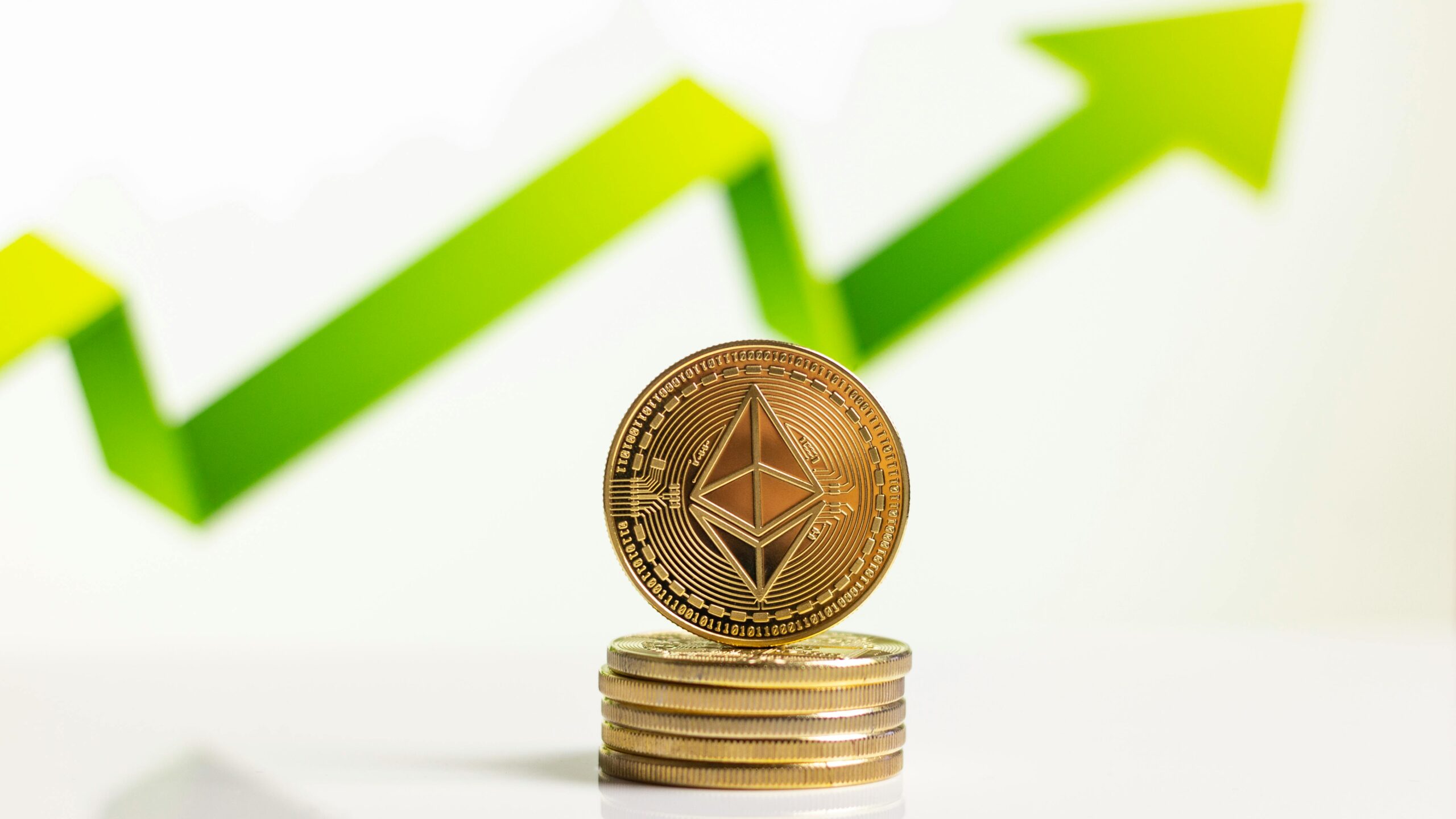 Stacked Ethereum coins with upward arrow indicating growth in digital currency market.